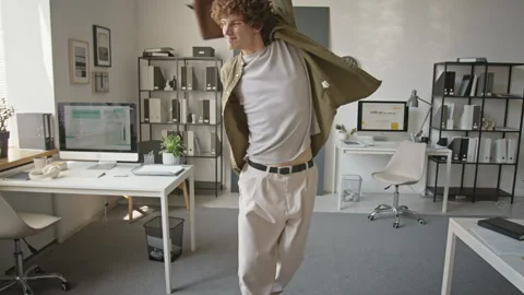 Happy Man Dancing with Briefcase in Office Celebrating Success Stock Footage 345251030
