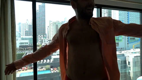 Happy man dancing in his expensive apartment, slow motion shot at 240fps Video stock 88536297