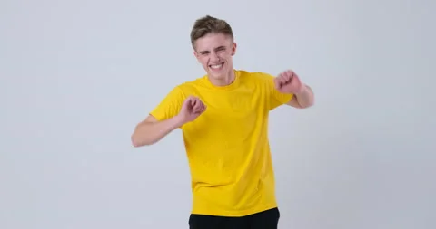 Happy Man dancing over white background Stockbeeldmateriaal 144957660