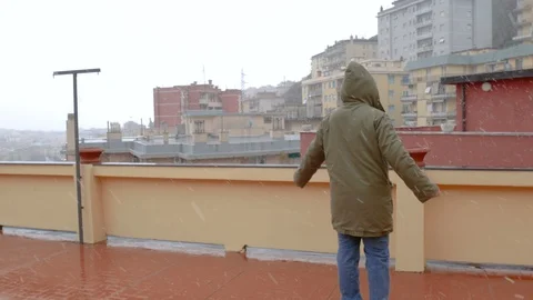 A happy man dancing under a falling snow Stock Footage 86515125