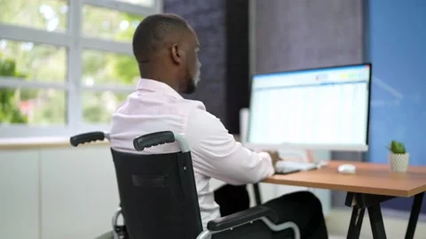 Happy Man With Disability Using Computer Video stock 215577869