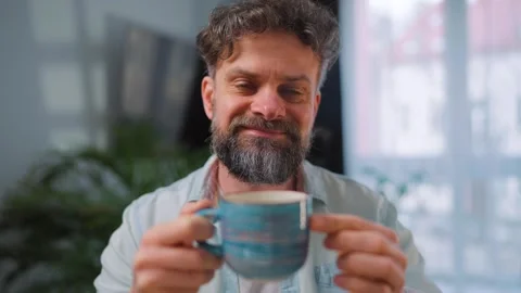 Happy man drinking coffee at relaxed home environment closeup. Video stock 343446846