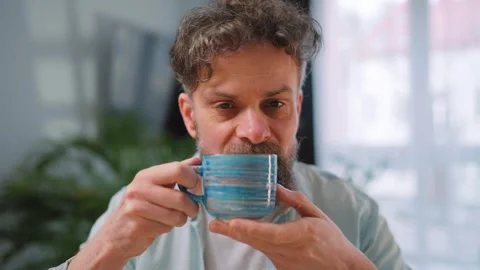Happy man drinking coffee at relaxed home environment closeup. Stock Footage 346728014