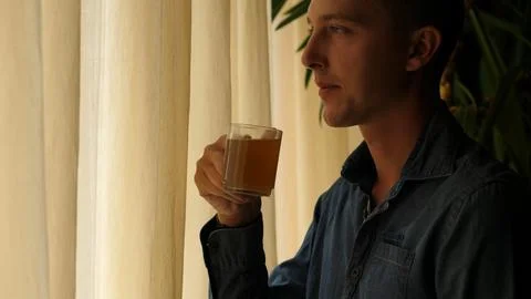 Happy Man Drinking Tea By the Window Stock Photos