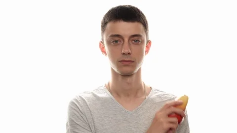 Happy man eats a pear Stock Footage 112770847