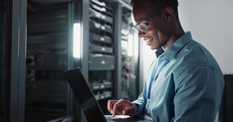 Happy man, engineer and laptop in server room for database update, cyber Stock Footage 266480151