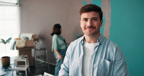 Happy man, face and tablet with paint for interior design, renovation tutorial Video stock 303589275