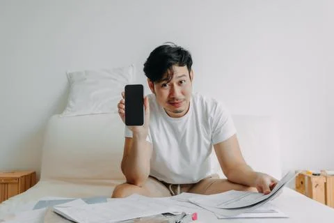 Happy man get application solution to solve finance documents problem. Stock Photos