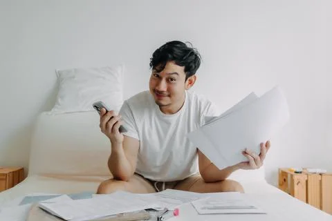 Happy man get application solution to solve finance documents problem. Stock Photos