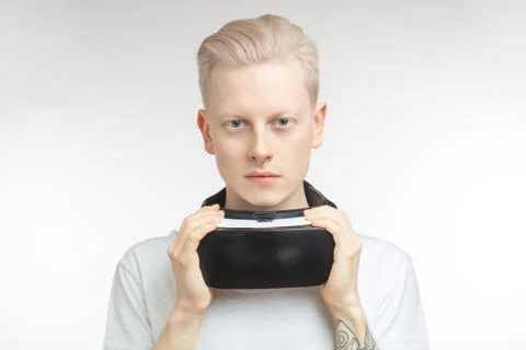 Happy man getting experience using VR headset glasses of virtual reality Stock Photos