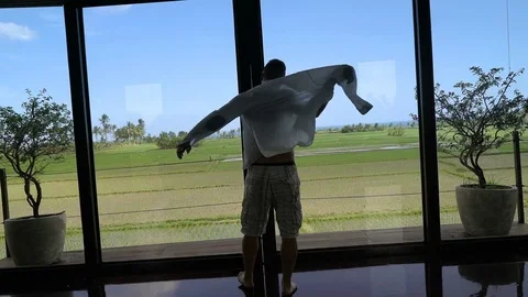 Happy man going outside and feels relaxed, steadycam shot Video stock 81087305