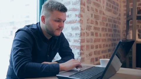 The happy man has fulfilled the task and has won, dances from the news Stock Footage 94048144