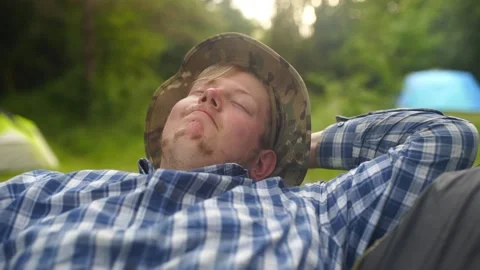 A happy man with a hat and small beard dreaming outdoors Stock Footage 151101312