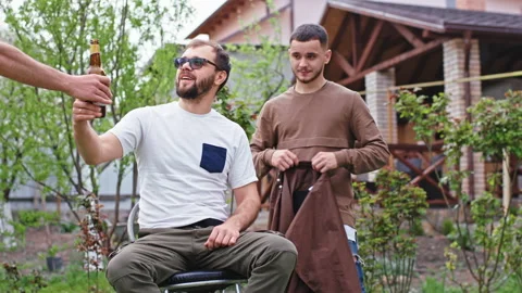 Happy man at home preparing to make a haircut at home in the garden in the Video stock 133953749