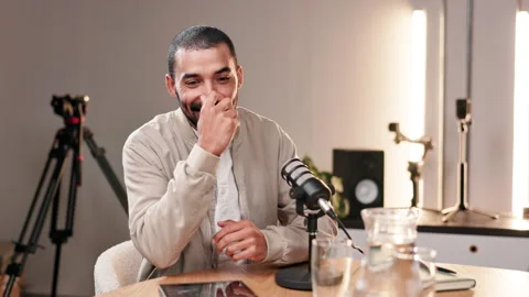 Happy man, interview and speaker with mic on podcast, audio broadcast or news Stockbeeldmateriaal 280673007