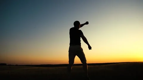 Happy man jumping on sunset sky background. Freedom feel good and travel adventu Stock Footage 202525084