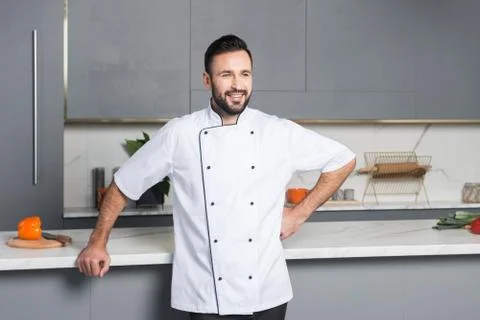 Happy man in the kitchen Stock Photos