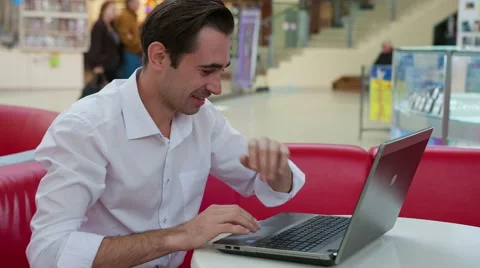 Happy man on a laptop Stock-Footage 43343988