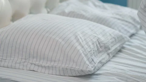 Happy man lays down in bed and quickly falls asleep, daytime sleep Stock Footage 132641028