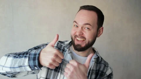 Happy man looking approvingly at camera showing thumbs up, like positive sign Stock Footage 237392269