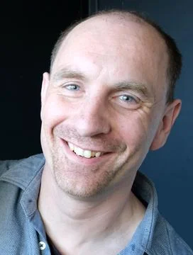 Happy man looking into the camera Stock Photos