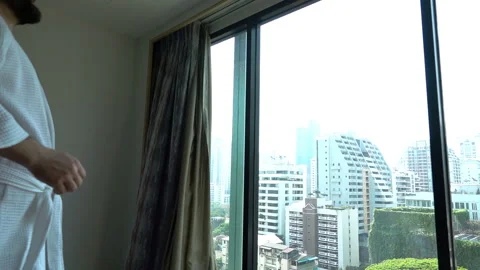 Happy man looking at the view from window and looks joyful, slow motion shot  Video stock 88279114