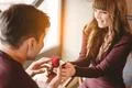 The happy man makes an offer to his girlfriend in the restaurant Photo