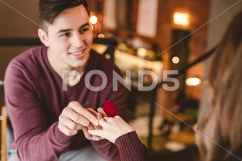 The happy man makes an offer of marriage to his girlfriend Stock Photos