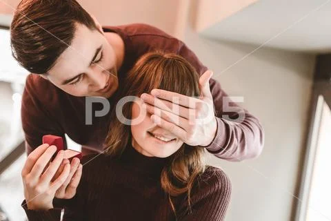 The happy man makes an offer of marriage to his girlfriend Stock Photos