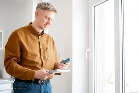 Happy Man Measuring Window Opening Stock Photos