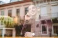 The happy man phone over the window in the restaurant Photo