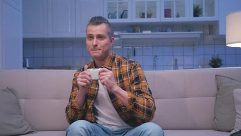 Happy Man Playing Video Console at Gamepad Joystick Controller and Winning Game Stock Footage 247553810