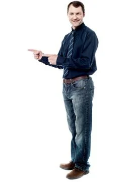 Happy man pointing at something Stock Photos