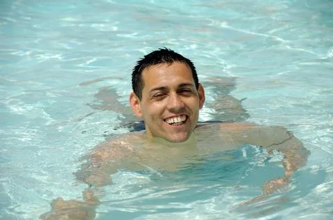 Happy man in pool Stock Photos