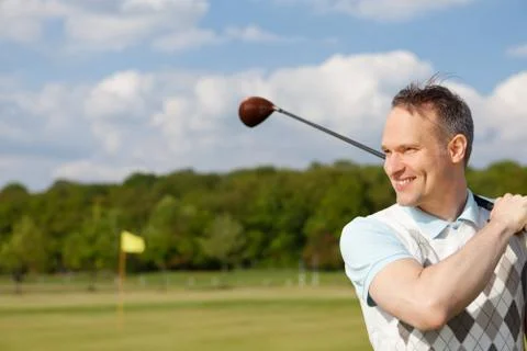 Happy man practising golf Stock Photos