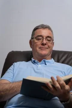 Happy Man reading Stock Photos