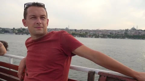 Happy man resting on deck feeling free watching sunset from ship Stock Footage 255113586
