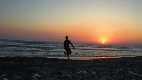 Happy man running on beach, jumping and celebrating success Stock-Footage 133374391