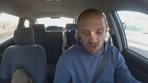 Happy man singing with passion and confidence driving car pointing finger Video stock 106931215