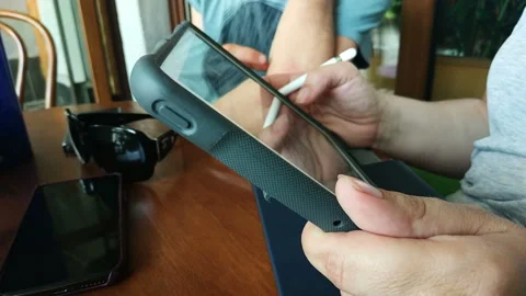 Happy man sitting on the bench using tablet Stock Footage 111502489