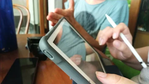 Happy man sitting on the bench using tablet Stock Footage 111502596