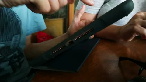 Happy man sitting on the bench using tablet Stock Footage 111502943