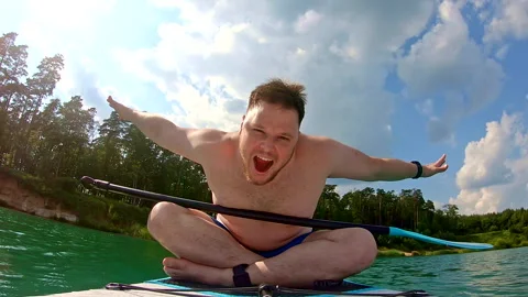 Happy man sitting on the supboard Stock Footage 246525439
