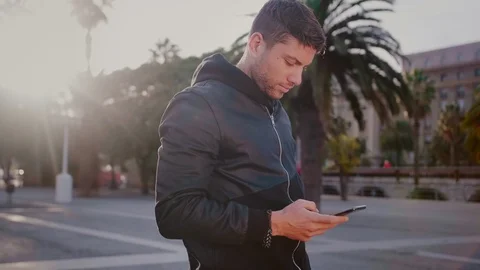 Happy man smiling and lauthing of good news messaje or email he hired by phone Stock Footage 101489480