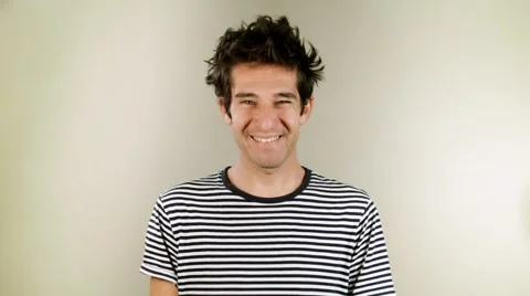 Happy man smiling in studio on neutral background. Close up Stock Footage 58945865