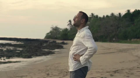 Happy man standing on the beach, super slow motion, shot at 240fps HD Stock Footage 55322013