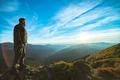 The happy man standing on the beautiful mountain landscape background Photo