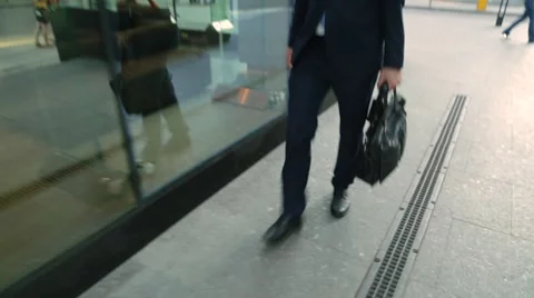 Happy man in a suit walking down the street Stock-Footage 68385232