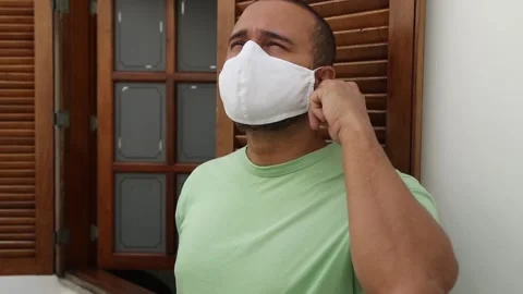 Happy man taking off their mask Stock Footage 131482011