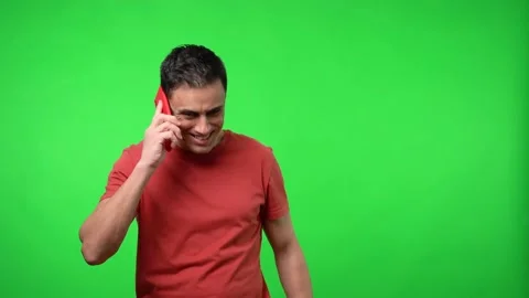 Happy man talking on the mobile. Chroma green background. Stock Footage 148717855